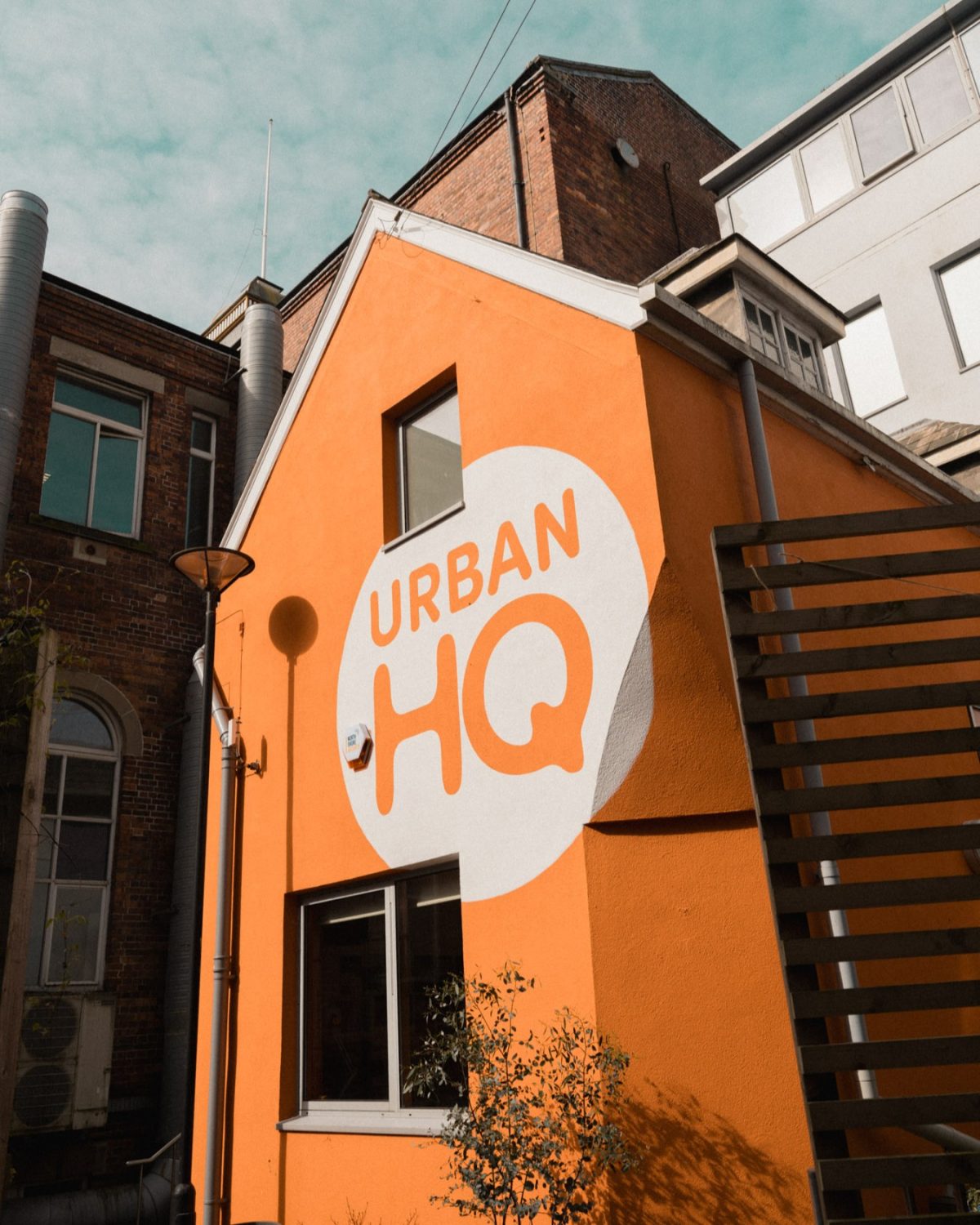 Urban HQ, a bright orange building with a modern atmosphere