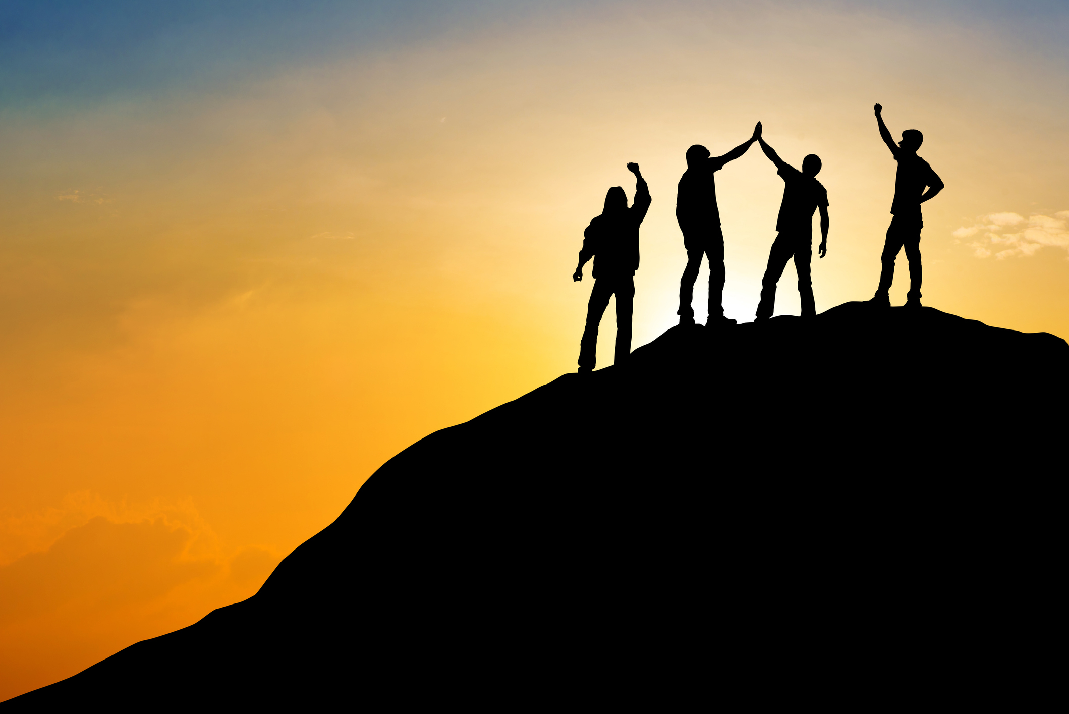 Group of people on peak mountain with sunset background ,team work success business winner concept